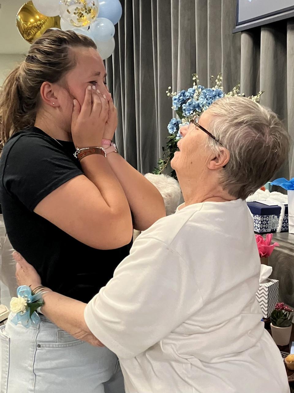 Sophia Weiksnar, 19, tears up as she bids farewell to her former principal, Sister Kathy Avery, who is leaving St. Clare of Montefalco Catholic School in Grosse Pointe Park after 16 years of service. Weiksnar is one of hundreds who attended Avery's farewell celebration on Sept. 24, 2023.