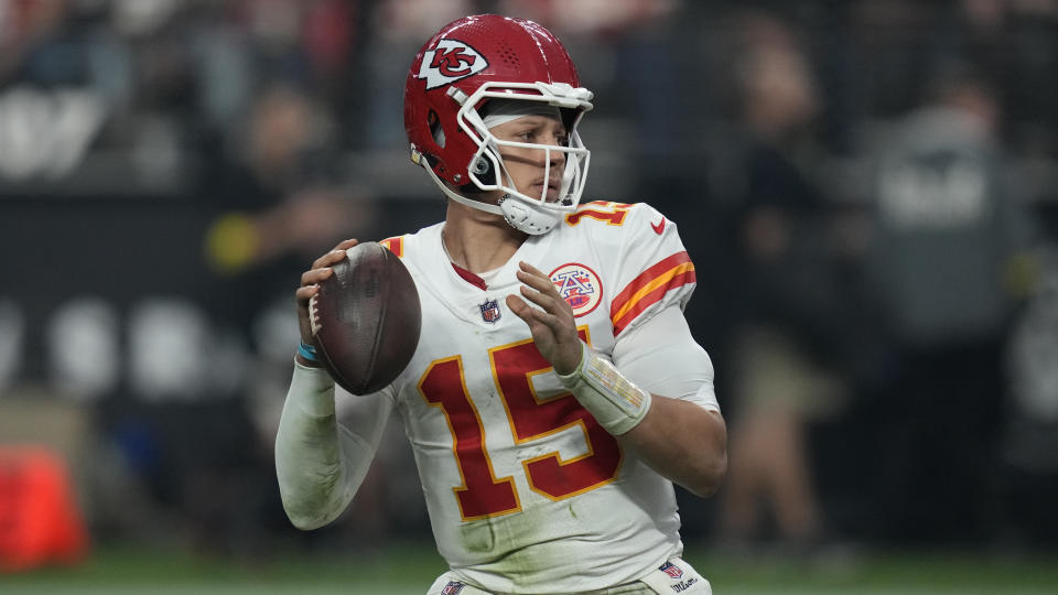 Kansas City Chiefs quarterback Patrick Mahomes (15) looks to throw against the Las Vegas Raiders during the second half of an NFL football game, Wednesday, Jan. 11, 2023, in Las Vegas. (AP Photo/John Locher)