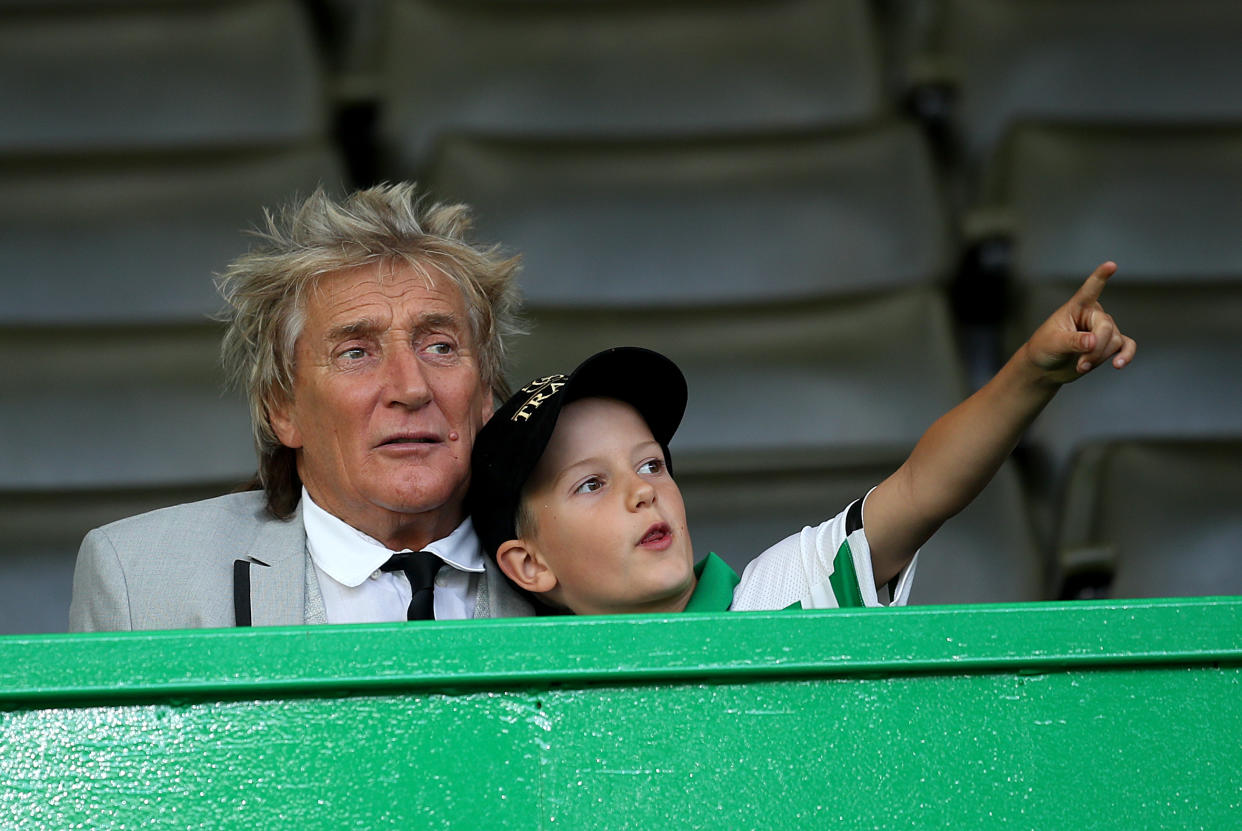 Rod Stewart in the stands with son Aiden during the UEFA Champions League third qualifying round second leg match at Celtic Park, Glasgow. (Getty Images)