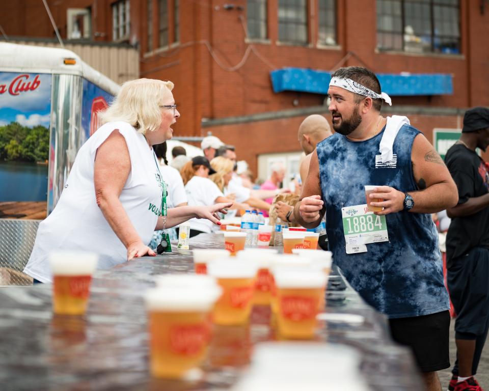 Many area residents consider the Boilermaker Post-Race Party, seen here in an O-D file photo from 2023, the highlight of the Boilermaker Road Race. This year the free beer is under threat unless the New York State Assembly passes a bill to save it before this year' race.