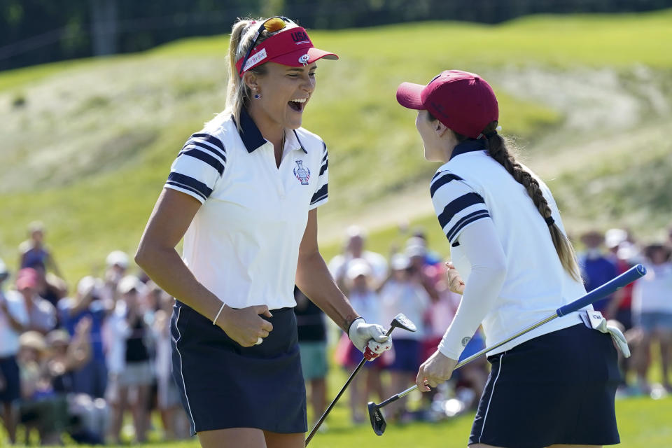 United States' Lexi Thompson and Brittany Altomare celebrate their win against Europe's Charley Hull and Emily Kristine Pedersen on the 17th hole during the foursome matches at the Solheim Cup golf tournament, Sunday, Sept. 5, 2021, in Toledo, Ohio. (AP Photo/Carlos Osorio).