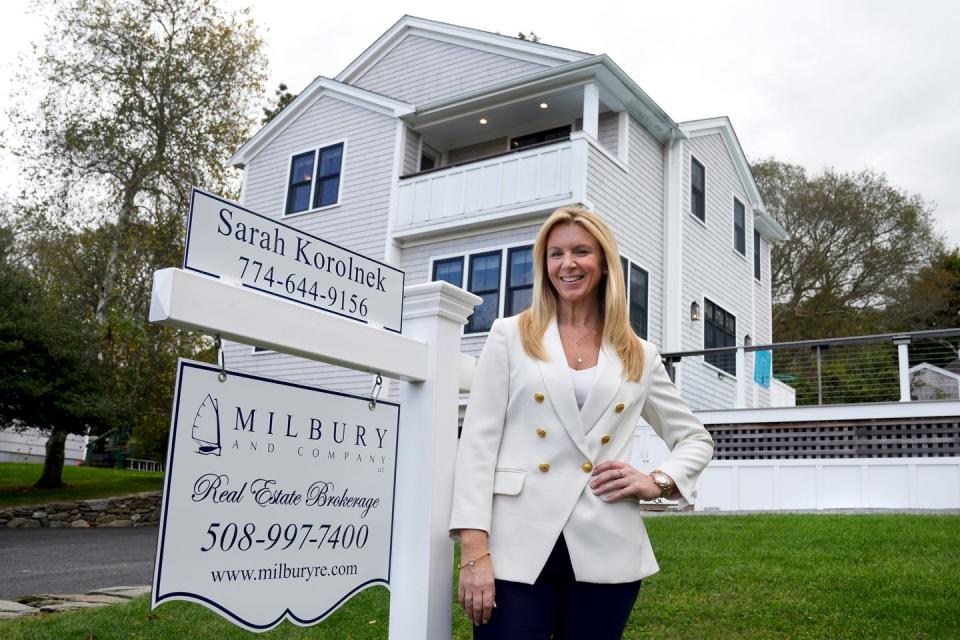 Real estate agent Sarah Korolnek at a home on Bernard Lane in Little Compton. The town has the state's second-highest median price of residential properties, $1 million, second only to New Shoreham's $1.58 million.
