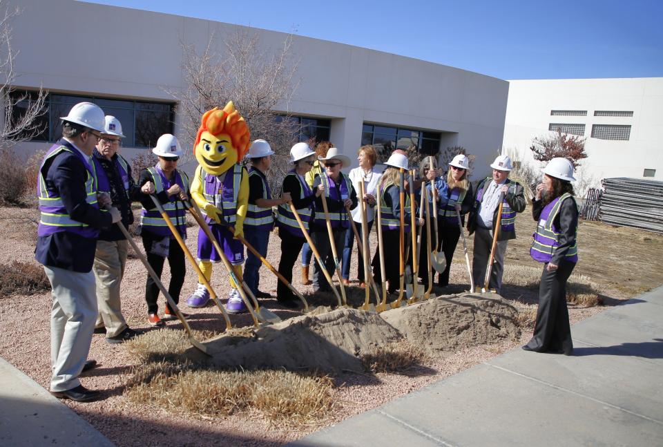 San Juan College President Toni Hopper Pendergrass organizes dignitaries for a groundbreaking ceremony for the school's new student health center on Friday, Feb. 23 in front of the Health and Human Performance Center on the college campus in Farmington.