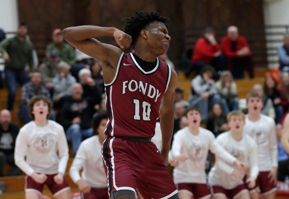 Fond du Lac's Jamariea Dalton celebrates after sinking a basket during the Cardinals' 68-66 victory over Neenah. The Cardinals remain atop the Fox Valley Association and the latest area boys basketball rankings.