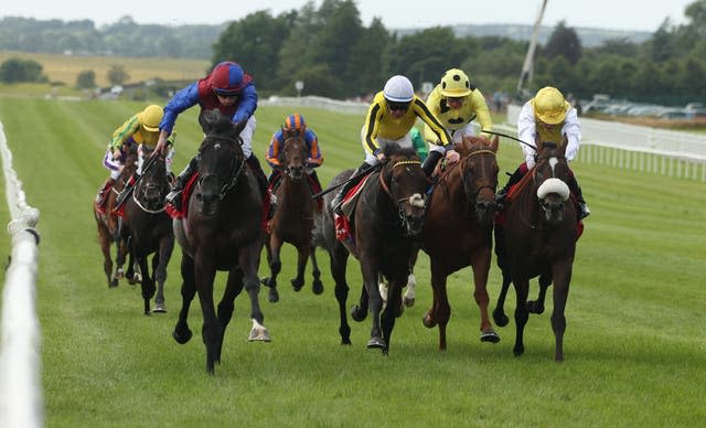 Ryan Moore rides Los Angeles, left, to Dubai Duty Free Irish Derby victory at The Curragh