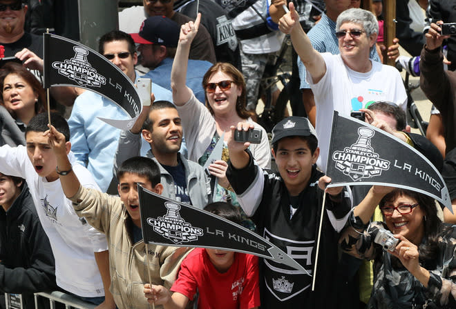 LOS ANGELES, CA - JUNE 14: Los Angeles Kings fans show their support along the parade route during the Los Angeles Kings Stanley Cup Victory Parade on June 14, 2012 in Los Angeles, California. (Photo by Victor Decolongon/Getty Images)