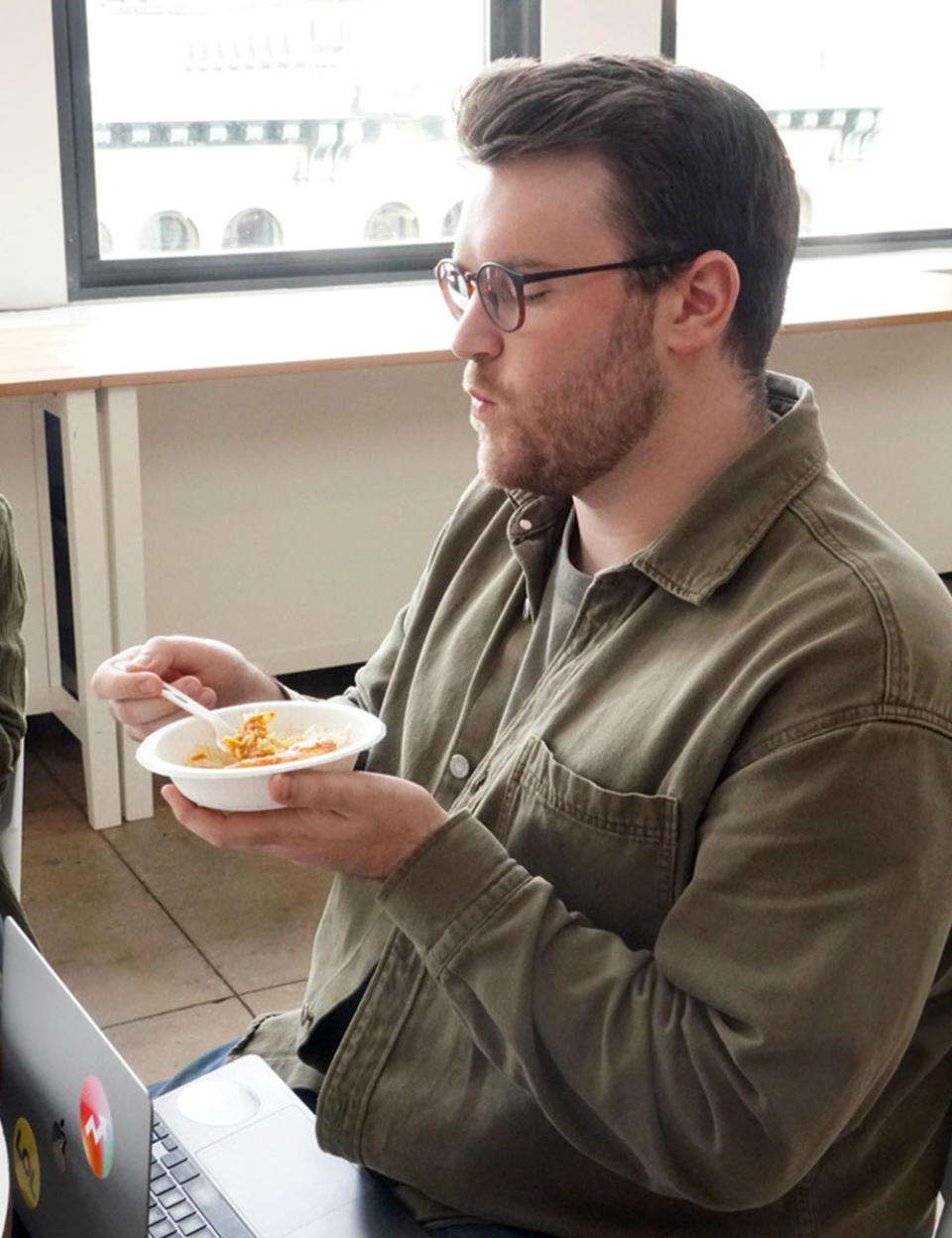 A man eating chicken tikka masala