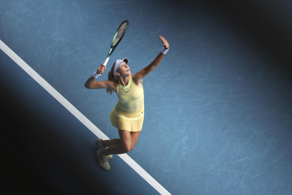 Mirra Andreeva of Russia serves to Barbora Krejcikova of the Czech Republic during their fourth round match at the Australian Open tennis championships at Melbourne Park, Melbourne, Australia, Sunday, Jan. 21, 2024. (AP Photo/Asanka Brendon Ratnayake)