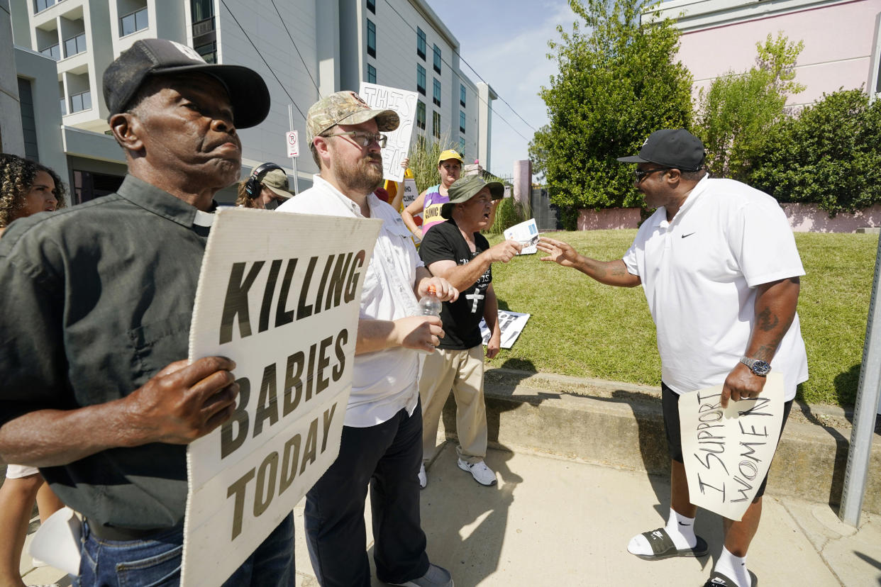 Abortion-rights supporter with argues with anti-abortion activists (Rogelio V. Solis / AP)