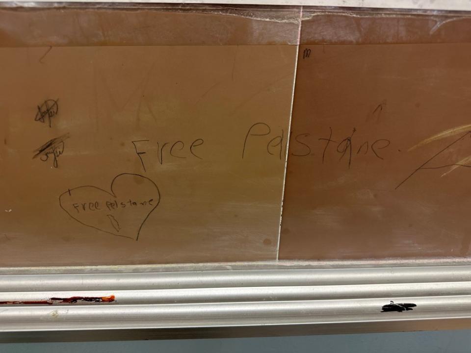 “Free Pelstane” written on a bulletin board at Origins HS.