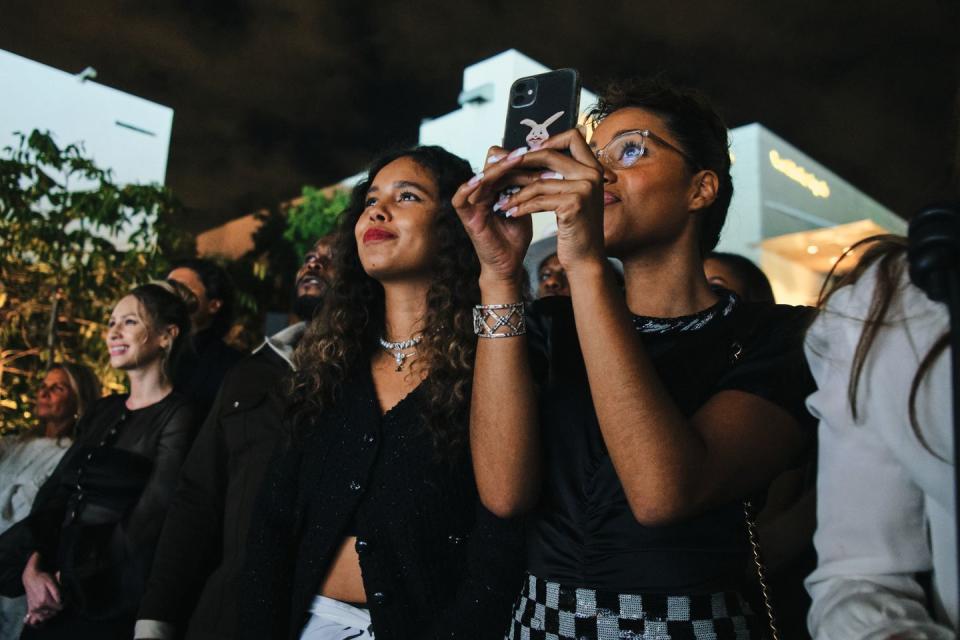 <p>Alisha Boe and Skye Bennike watch the performance.</p>