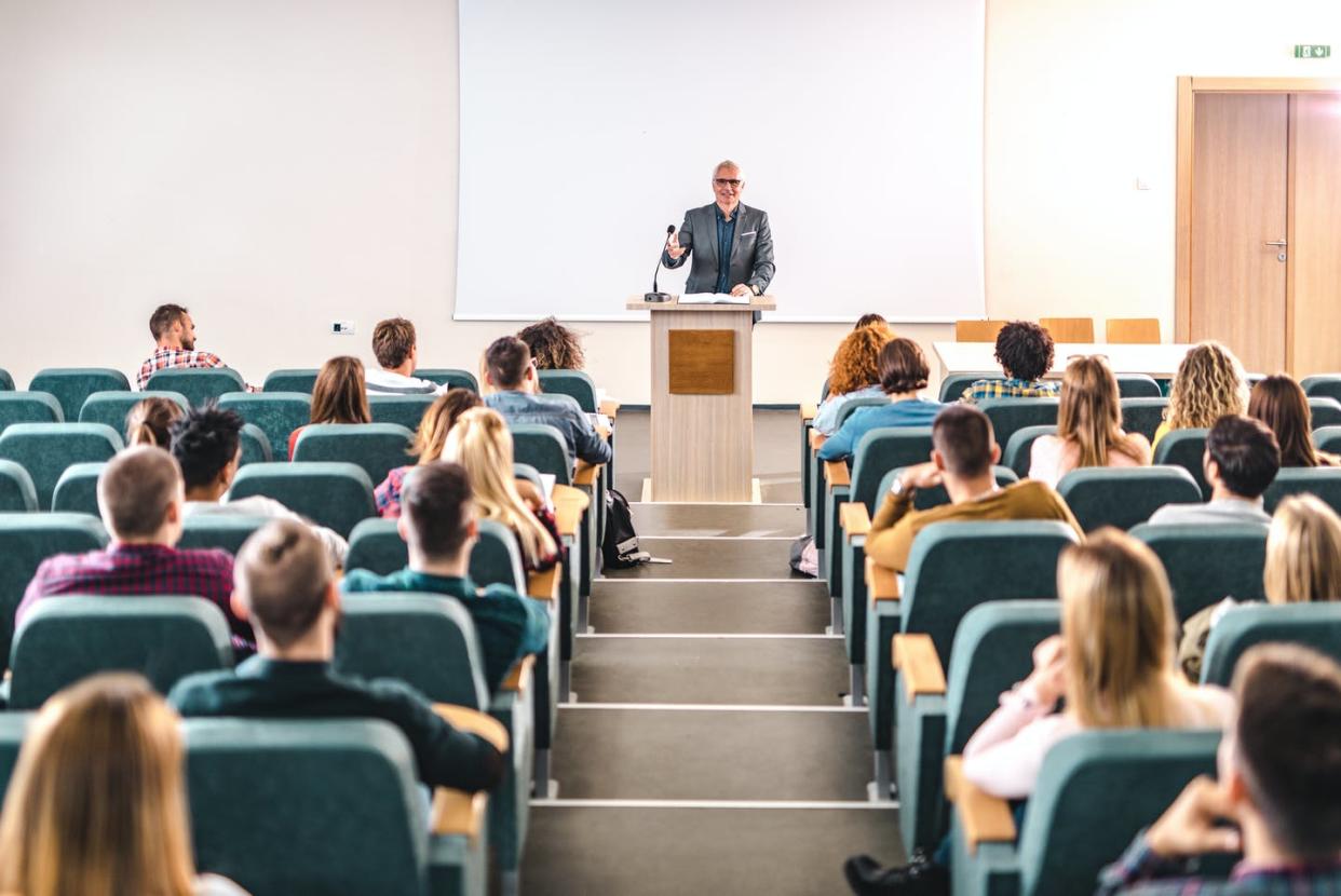 <span class="caption">Some colleges and universities may be using AI technology to help teach their students. </span> <span class="attribution"><a class="link " href="https://www.gettyimages.com/detail/photo/happy-mature-professor-giving-a-lecture-in-front-of-royalty-free-image/1223135348?adppopup=true" rel="nofollow noopener" target="_blank" data-ylk="slk:skynesher/E+ via Getty Images;elm:context_link;itc:0;sec:content-canvas">skynesher/E+ via Getty Images</a></span>