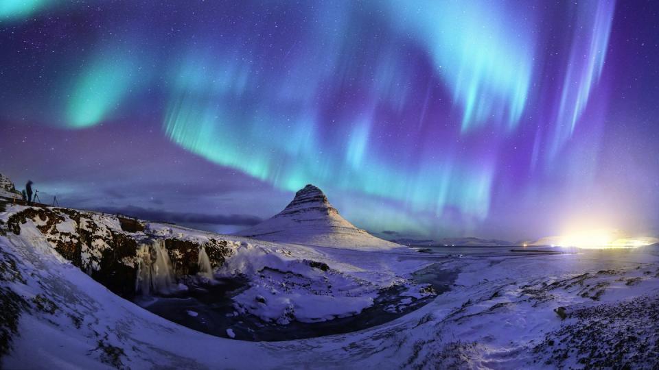 <p>The Aurora Borealis, arguably the most spectacular natural phenomenon, on full display over Mount Kirkjufell in Iceland.</p>