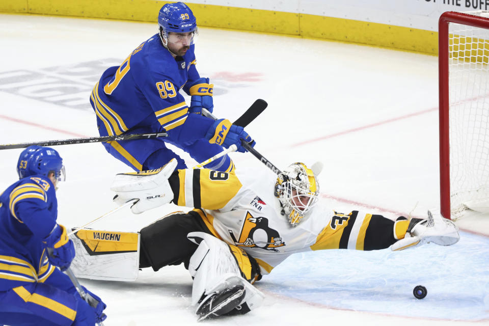 Buffalo Sabres right wing Alex Tuch (89) is stopped by Pittsburgh Penguins goaltender Alex Nedeljkovic (39) during the third period of an NHL hockey game Friday, Nov. 24, 2023, in Buffalo N.Y. (AP Photo/Jeffrey T. Barnes)
