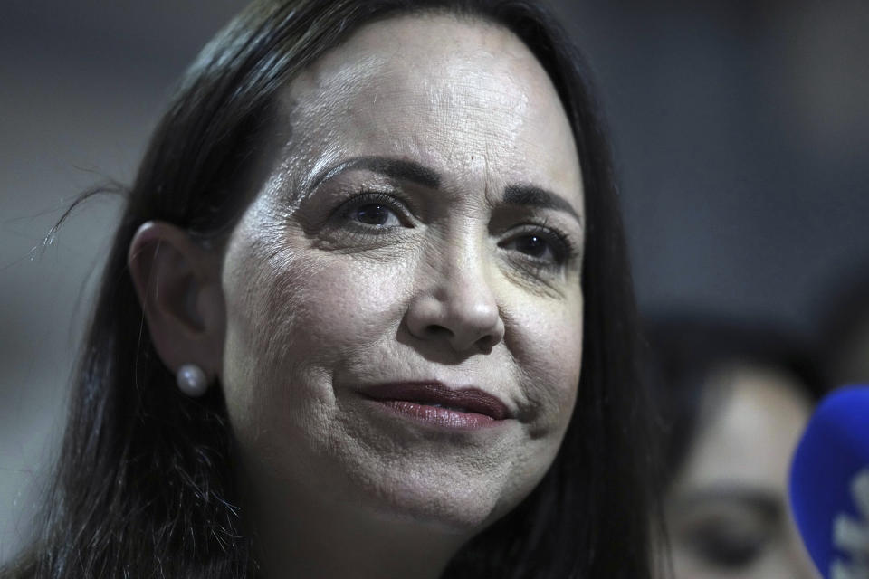 Opposition leader María Corina Machado pauses during a press conference regarding the arrest order for her campaign manager and eight other opposition members for alleged involvement in a conspiracy plot to destabilize the government, in Caracas, Venezuela, Wednesday, March 20, 2024. Machado has been disqualified from holding public office for 15 years but has continued to campaign for president ahead of the July 28 elections. (AP Photo/Ariana Cubillos)