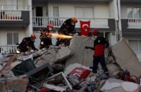 Rescue operations take place on a site after an earthquake struck the Aegean Sea, in the coastal province of Izmir