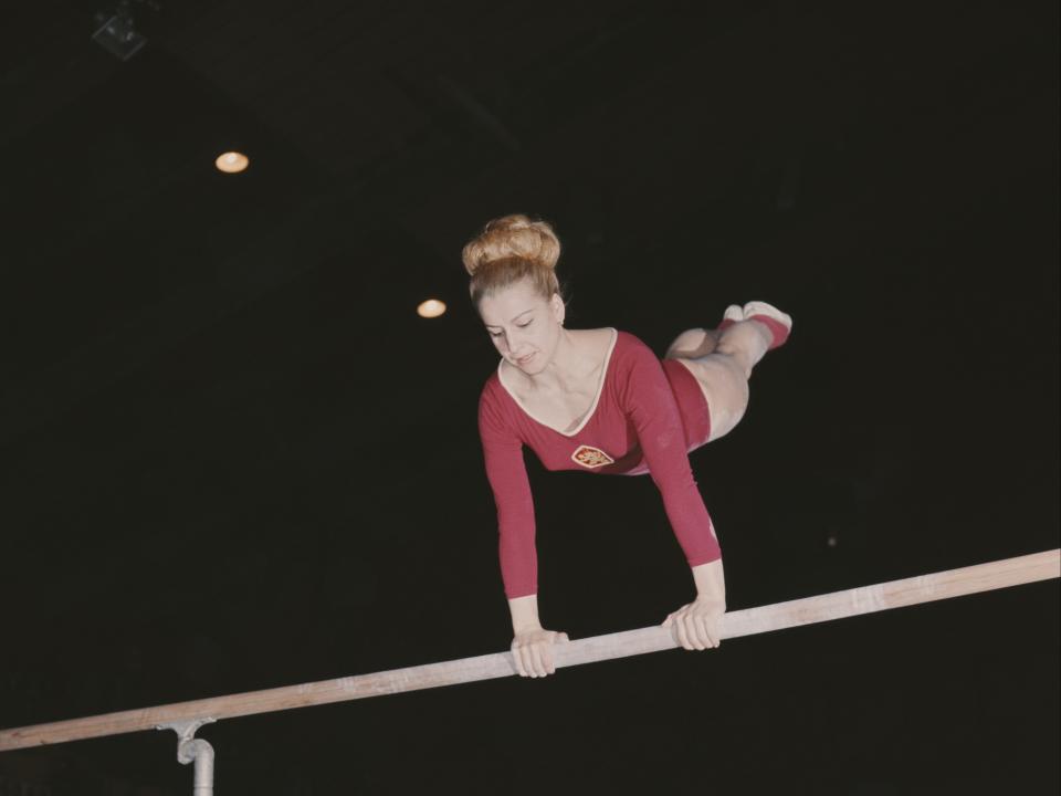 Czech gymnast and seven time Olympic Gold medallist Vera Caslavska competes on the uneven bars 1st June 1968 in London (Getty Images)