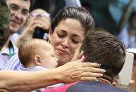<p>Michael Phelps (USA) of USA greets his fiance Nicole Johnson and their son Boomer after he won the gold medal. REUTERS/Stefan Wermuth </p>