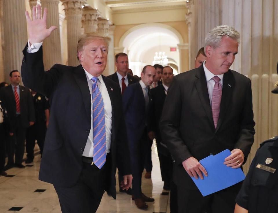 Stephen Miller is seen in the background, center, as Donald Trump and House majority leader Kevin McCarthy leave a meeting on Capitol Hill on Tuesday.