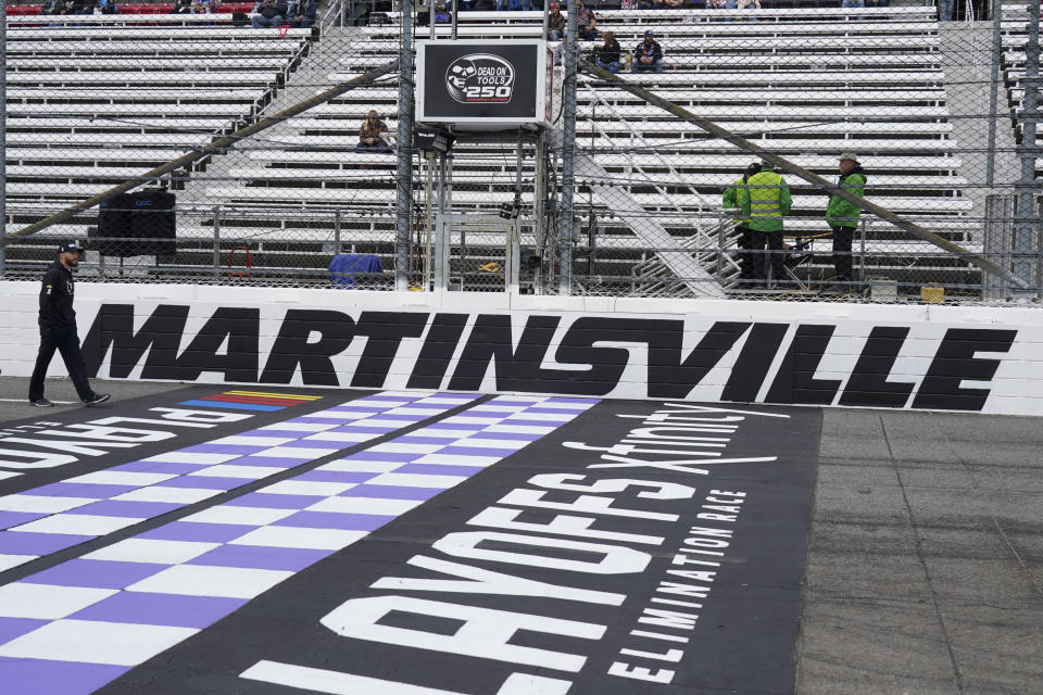 Ross Chastain walks the track before practice for the NASCAR Cup Series auto race at Martinsville Speedway, Saturday, Oct. 29, 2022, in Martinsville, Va. (AP Photo/Chuck Burton)
