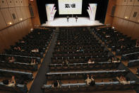 Comedians perform in front of audience as a hall reopened after the closure of three and a half months, in Osaka, western Japan Friday, June 19, 2020. All domestic restrictions were removed Friday and people can now start travel anywhere in Japan. Physical distancing and other preventive measures remain in place.(Kyodo News via AP)