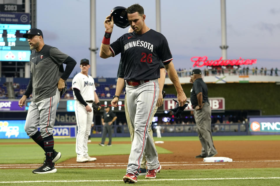 Minnesota Twins' Max Kepler (26) leaves the game with an apparent injury during the fourth inning of a baseball game against the Miami Marlins, Monday, April 3, 2023, in Miami. (AP Photo/Lynne Sladky)