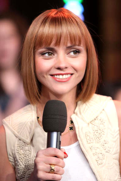 <p>Christina exudes quirkiness with this unorthodox orange bob.</p>