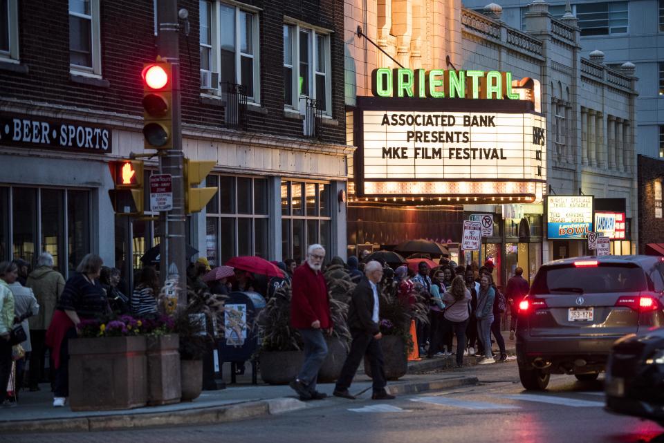 Theatergoers line the street for the Milwaukee Film Festival at the Oriental Theatre.