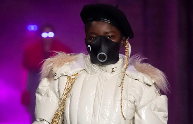 A model wearing a face mask on Marine Serre's Fall 2019 runway.