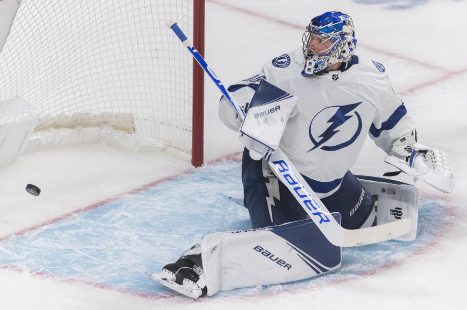 Tampa Bay Lightning's goaltender Andrei Vasilevskiy gives up a goal to Montreal Canadiens' Jeff Petry during the first period of an NHL hockey game Thursday, Jan. 2, 2020, in Montreal. (Graham Hughes/The Canadian Press via AP)