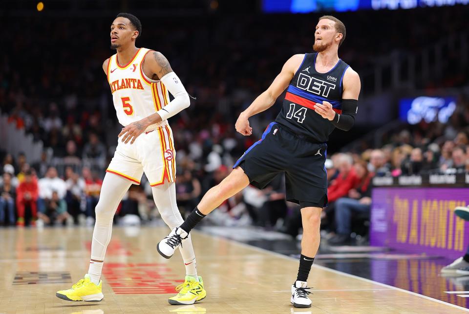Pistons guard Malachi Flynn watches his 3-point attempt against Hawks guard Dejounte Murray during the fourth quarter of the Pistons' 121-113 loss to the Hawks on Wednesday, April 3, 2024, in Atlanta.
