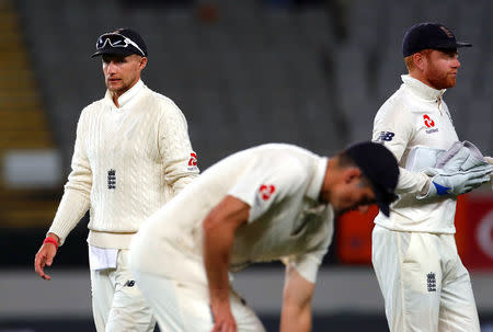 Cricket - Test Match - New Zealand v England - Eden Park, Auckland, New Zealand, March 22, 2018. England's captain Joe Root reacts as he walks off the ground with team mates at the end of the first day of the first cricket test match. REUTERS/David Gray