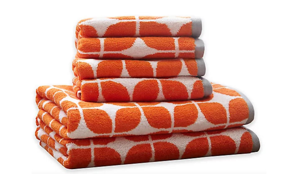 Stack of six orange patterned towels