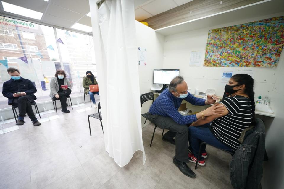 Niranjala Prabakar receives her Covid-19 booster vaccine jab at Copes Pharmacy in Streatham, south London (Yui Mok/PA) (PA Wire)