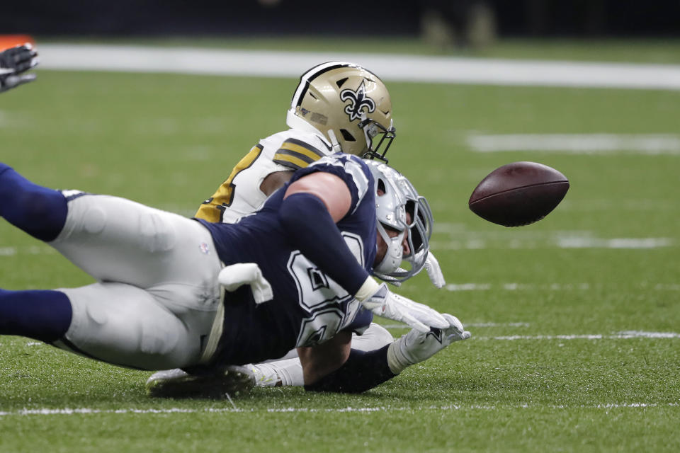 Dallas Cowboys tight end Jason Witten fumbles against New Orleans Saints strong safety Vonn Bell in the first half of an NFL football game in New Orleans, Sunday, Sept. 29, 2019. (AP Photo/Bill Feig)