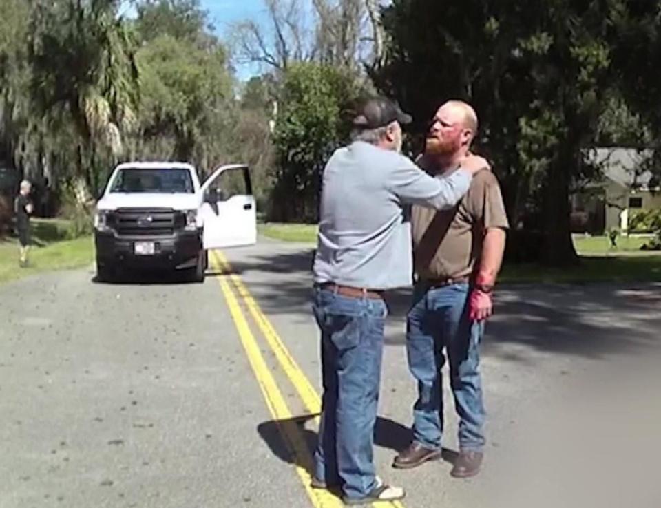 Police body cam video shows Gregory and Travis McMichael after the fatal shooting of Ahmaud Arbery on February 23, 2020.  / Credit: Glynn County Police Department