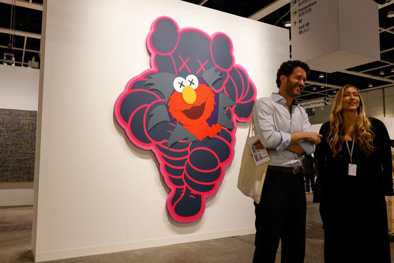 An installation titled "CHUM (KCC7)" by Brian Donnelly, known professionally as Kaws is displayed at Art Basel in Hong Kong