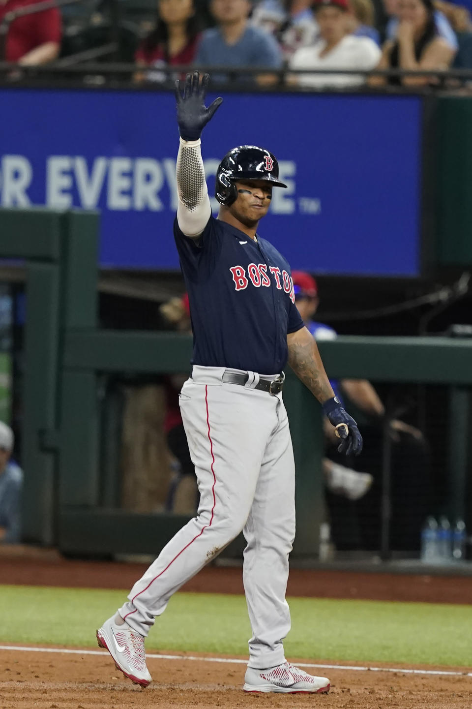 Boston Red Sox's Rafael Devers motions to the team's dugout after hitting an RBI single against the Texas Rangers during the third inning of a baseball game in Arlington, Texas, Friday, May 13, 2022. (AP Photo/LM Otero)