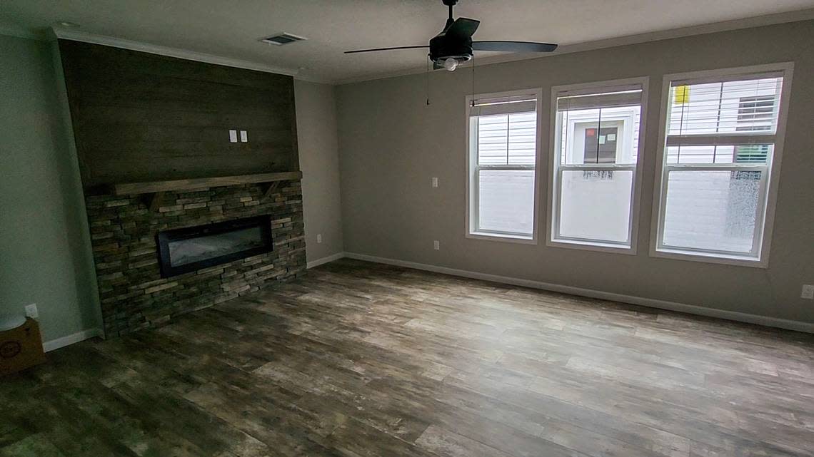 The open floor plan of the “Big Easy” manufactured home sold by Palmetto Homes of Beaufort is bright and shares space with the kitchen and dining area.