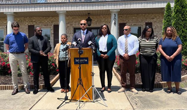 Attorney Carlos Moore holds a news conference with Aderrien Murry, an 11-year-old who was shot by a Indianola, Mississippi, police officer after the boy called 911 from his mother's home on May 20.