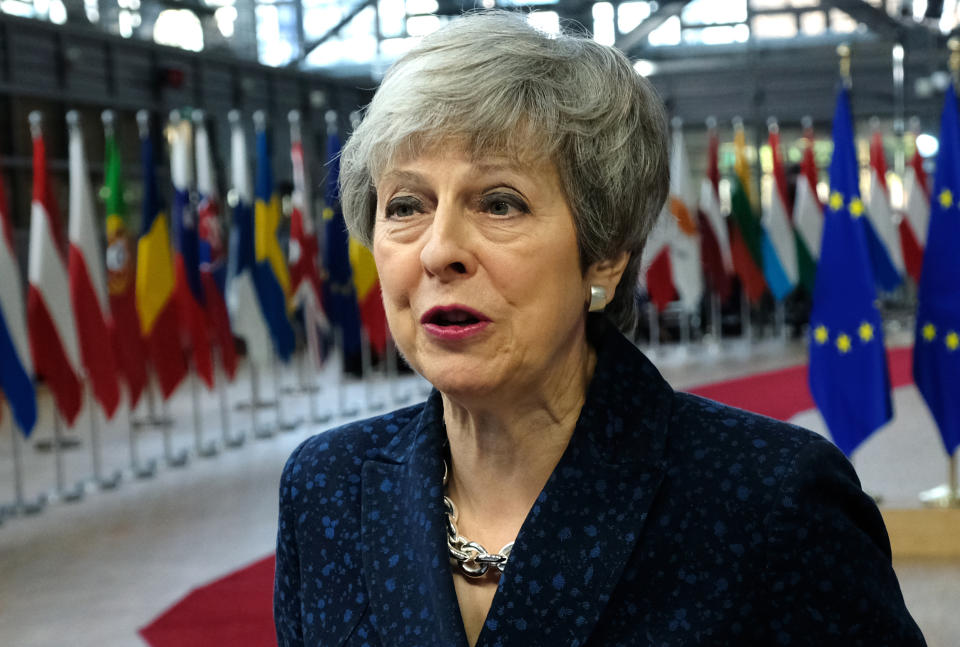 Theresa May speaks to the media as she arrives for a two-day summit of European Union leaders on March 21. (Getty)