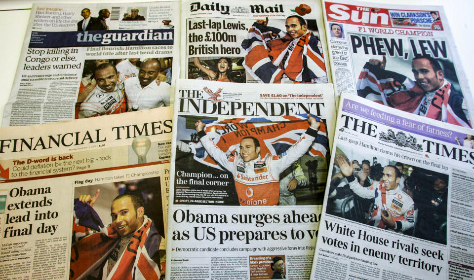 A selection of the front pages of Britian's national papers in London, on Nov. 3, 2008, showing the new Formula One Champion Lewis Hamilton celebrating in Sao Paulo, Brazil. (Martin Cleaver / AP file)