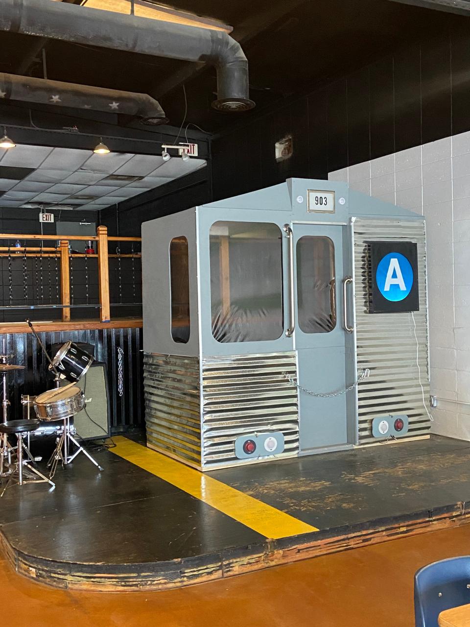 The model subway car on the City Dogs Cafe stage.