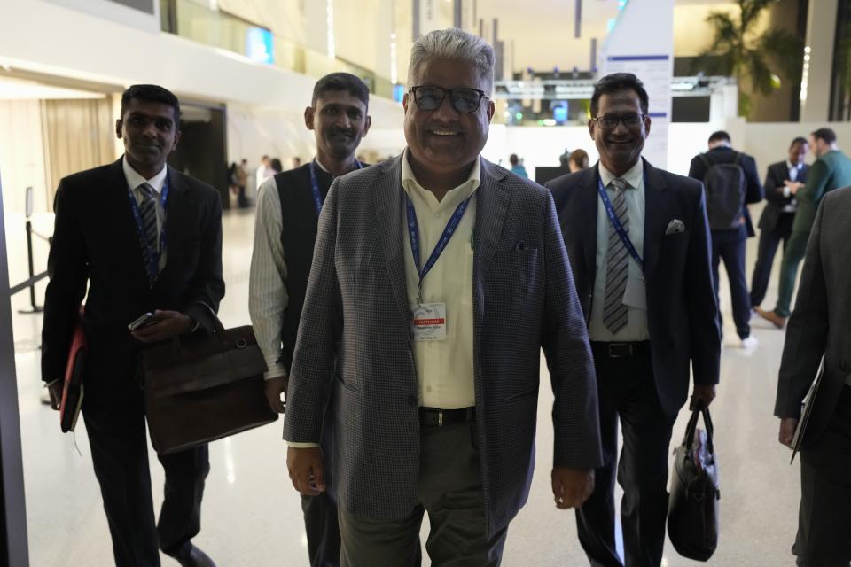 Bhupender Yadav, India environment and labor minister, walks through the COP28 U.N. Climate Summit after a meeting, Sunday, Dec. 10, 2023, in Dubai, United Arab Emirates. (AP Photo/Rafiq Maqbool)