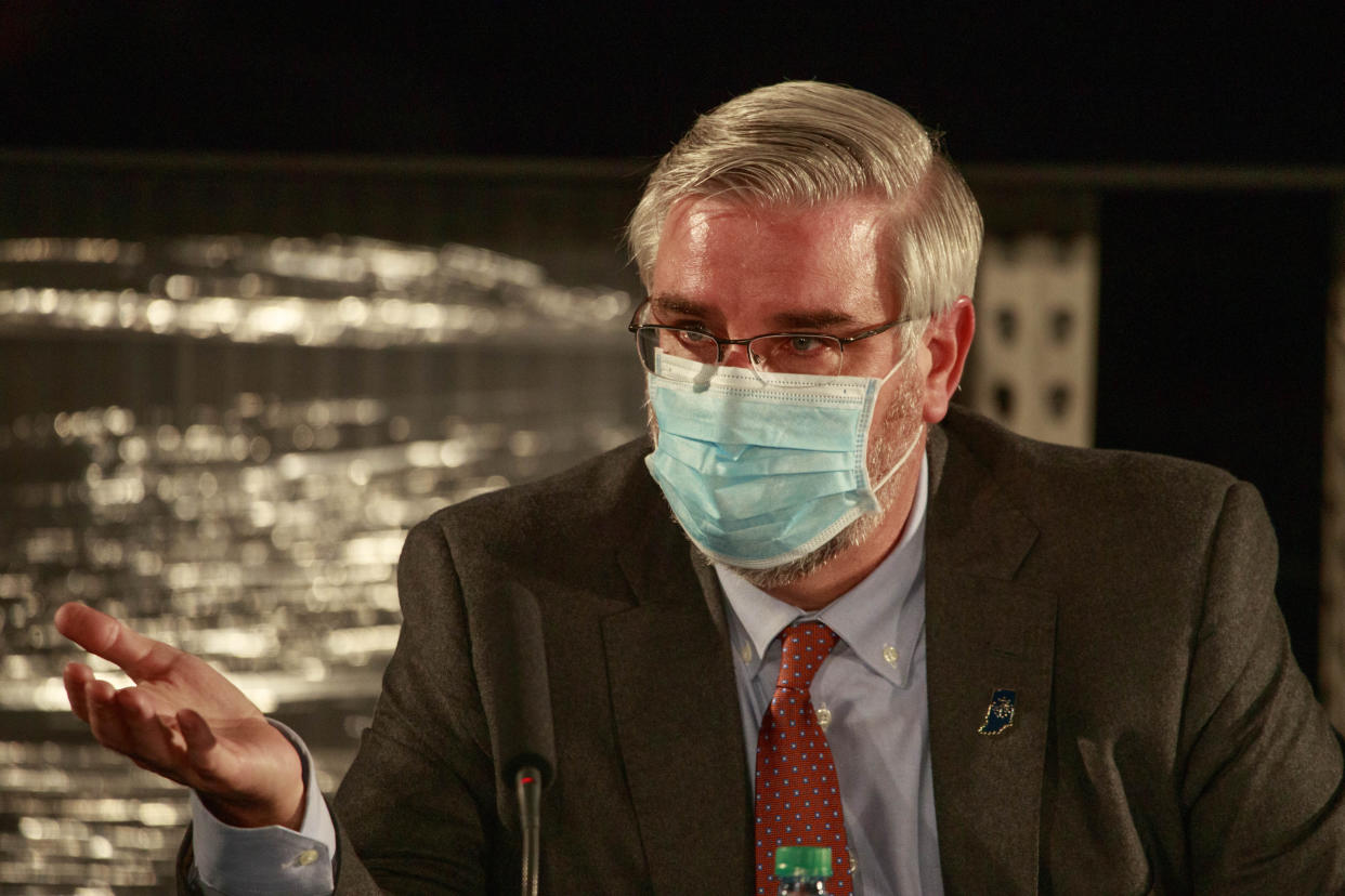 BLOOMINGTON, INDIANA, UNITED STATES - 2020/12/15: Indiana Governor Eric Holcomb wearing a face mask speaks during a round table discussion at Catalent Biologics, where COVID vaccine vials are being filled. (Photo by Jeremy Hogan/SOPA Images/LightRocket via Getty Images)