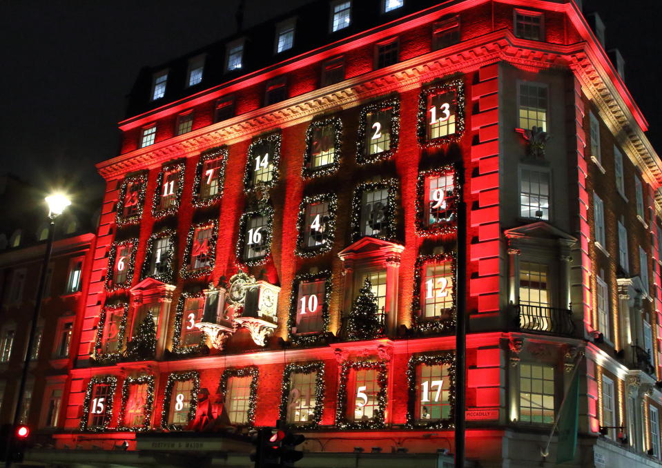 LONDON, UNITED KINGDOM - 2019/12/17: London's upmarket department store Fortnum & Mason in Piccadilly has been transformed into a giant advent calendar this Christmas.  Its iconic facade is bathed in red with its windows decorated and numbered like a traditional advent calendar. Its window displays are also some of the best in the capital for the festive season. (Photo by Keith Mayhew/SOPA Images/LightRocket via Getty Images)