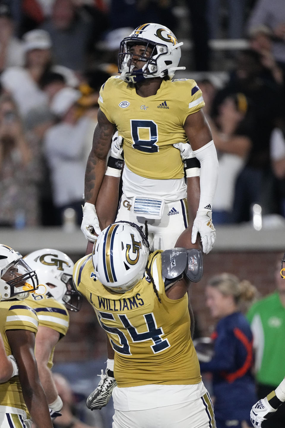 Georgia Tech wide receiver Malik Rutherford (8) celebrates with offensive lineman Jordan Williams (54) after a touchdown catch during the first half of an NCAA college football game against North Carolina, Saturday, Oct. 28, 2023, in Atlanta. (AP Photo/John Bzemore)