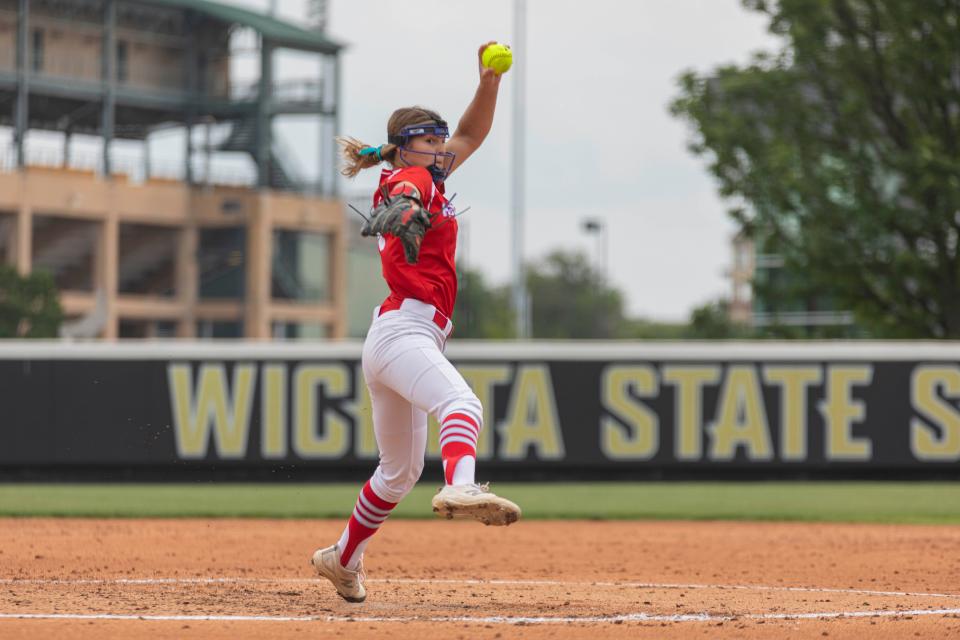 Shawnee Heights sophomore Grace Proctor (14) winds up a pitch against Bishop Carroll in the state softball quarterfinals held at Wilkins Stadium on Thursday, May 25, 2023.