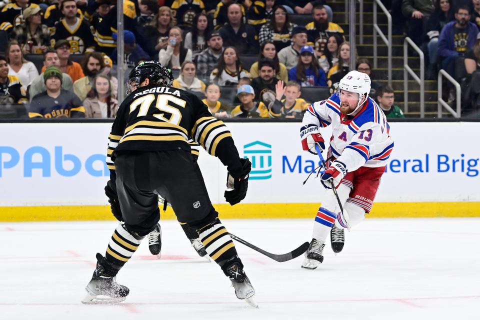 Sep 24, 2023; Boston, Massachusetts, USA; New York Rangers left wing Alexis Lafreniere (13) shoots the puck against the Boston Bruins during the second period at TD Garden.