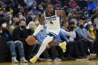 Minnesota Timberwolves guard Jaylen Nowell (4) dribbles the ball up the court against the Golden State Warriors during the first half of an NBA basketball game in San Francisco, Thursday, Jan. 27, 2022. (AP Photo/Jeff Chiu)